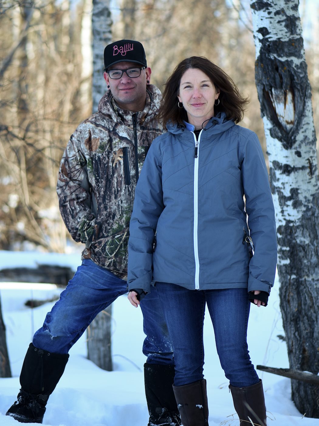 Chartrand and Jennifer Cockrall-King, co author of his book tawâw, stand outside in the snow in front of trees.