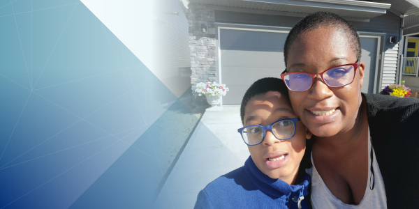 Scholarship recipient Samantha pictured with her son