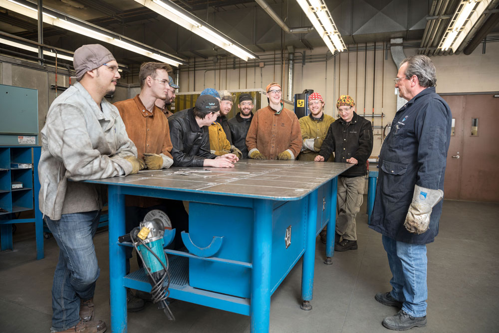 Welder instructor and students