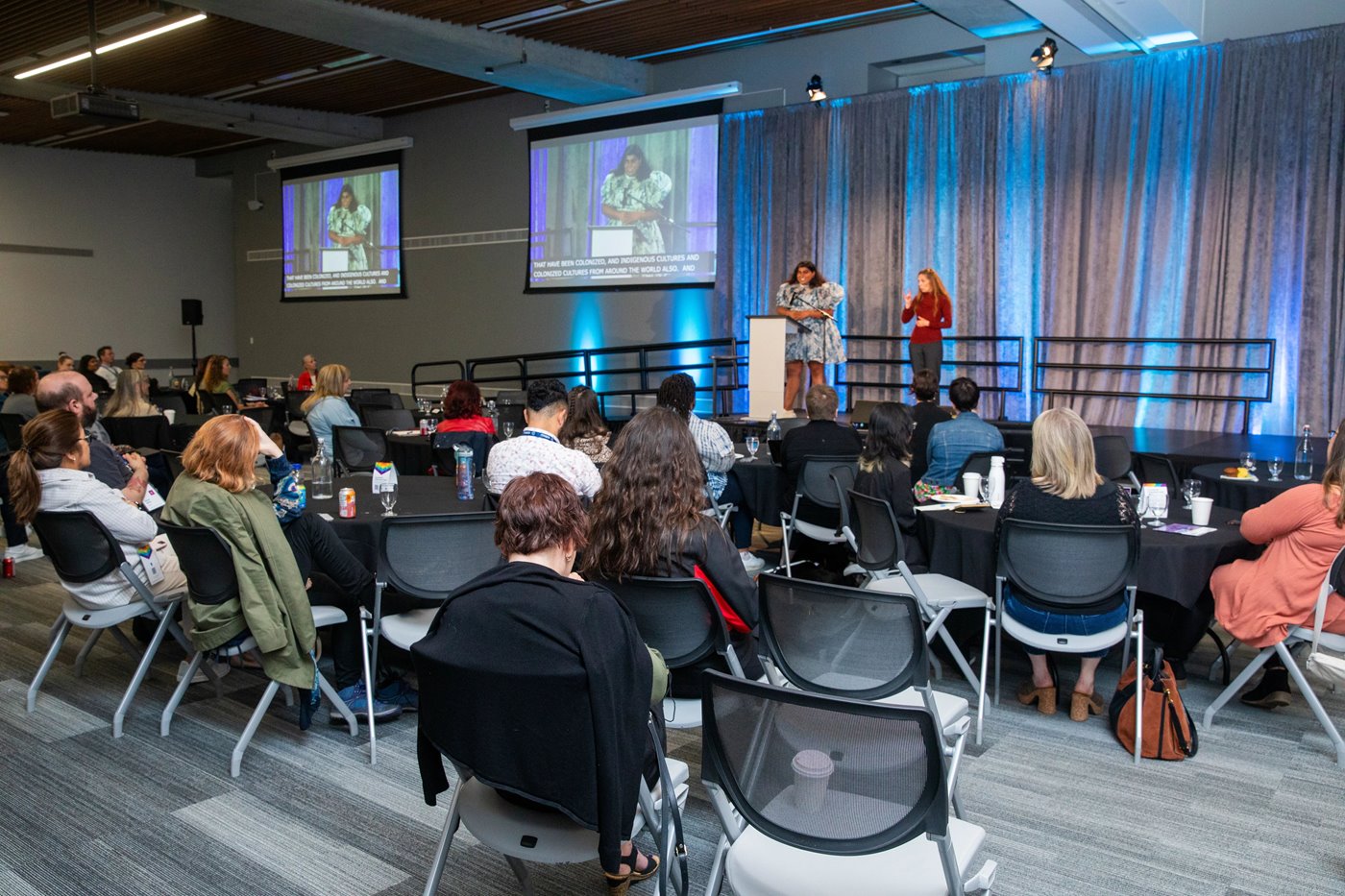 AccessAbility Symposium 2023 conference room with attendees and speakers