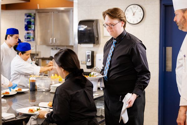 Culinary Arts students serving at Ernest's