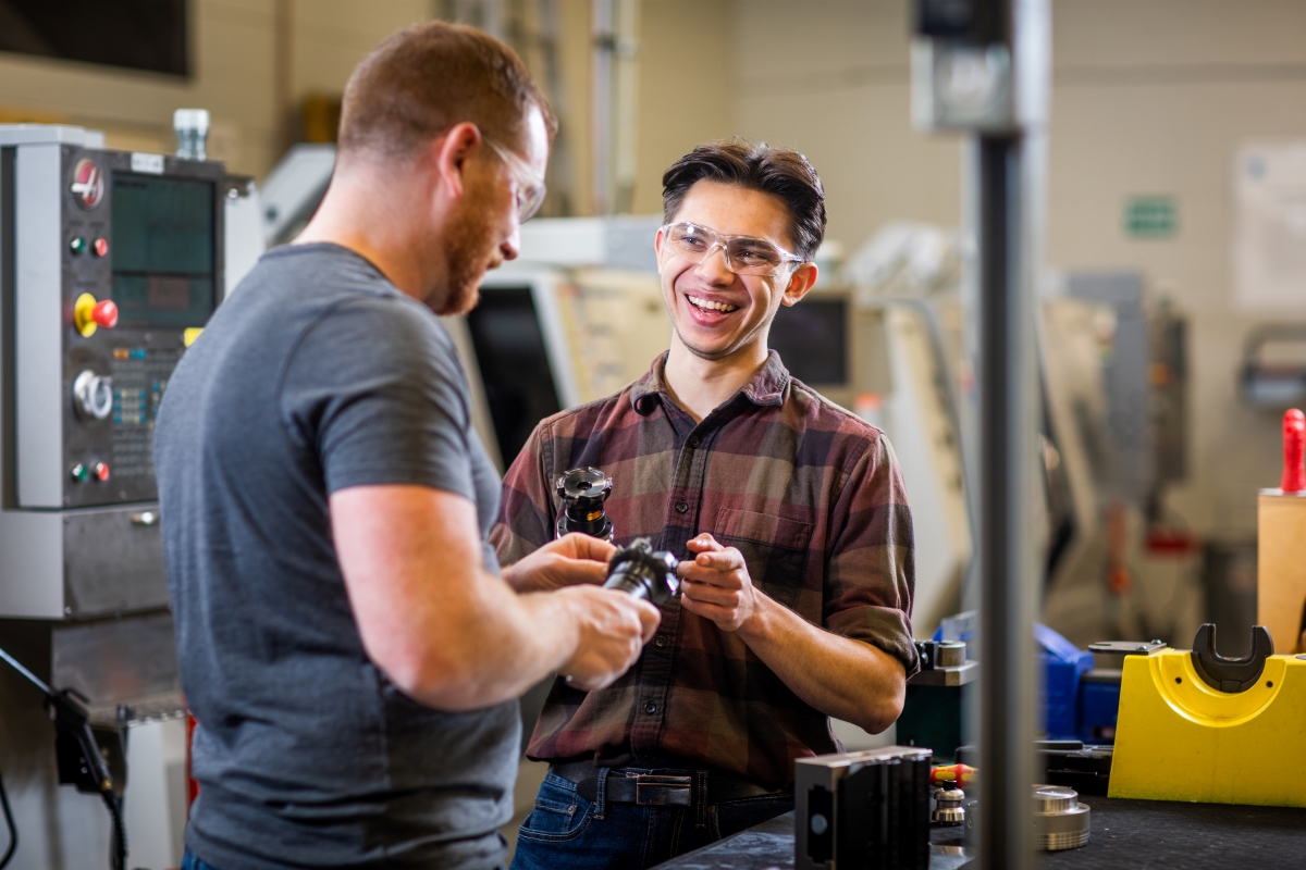 Vance Monaghan working in the machinist lab with his teacher