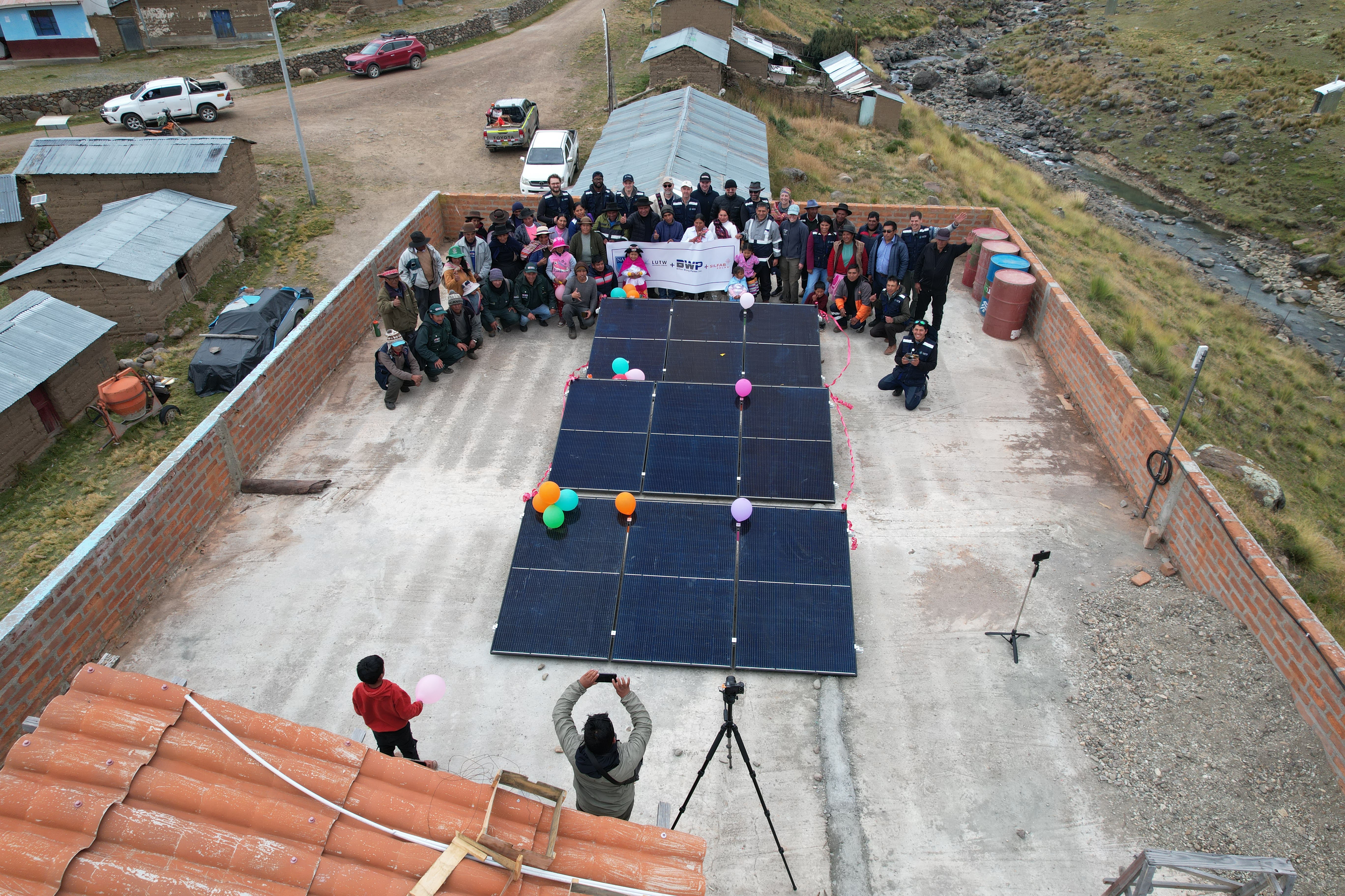 Students in peru with solar panels
