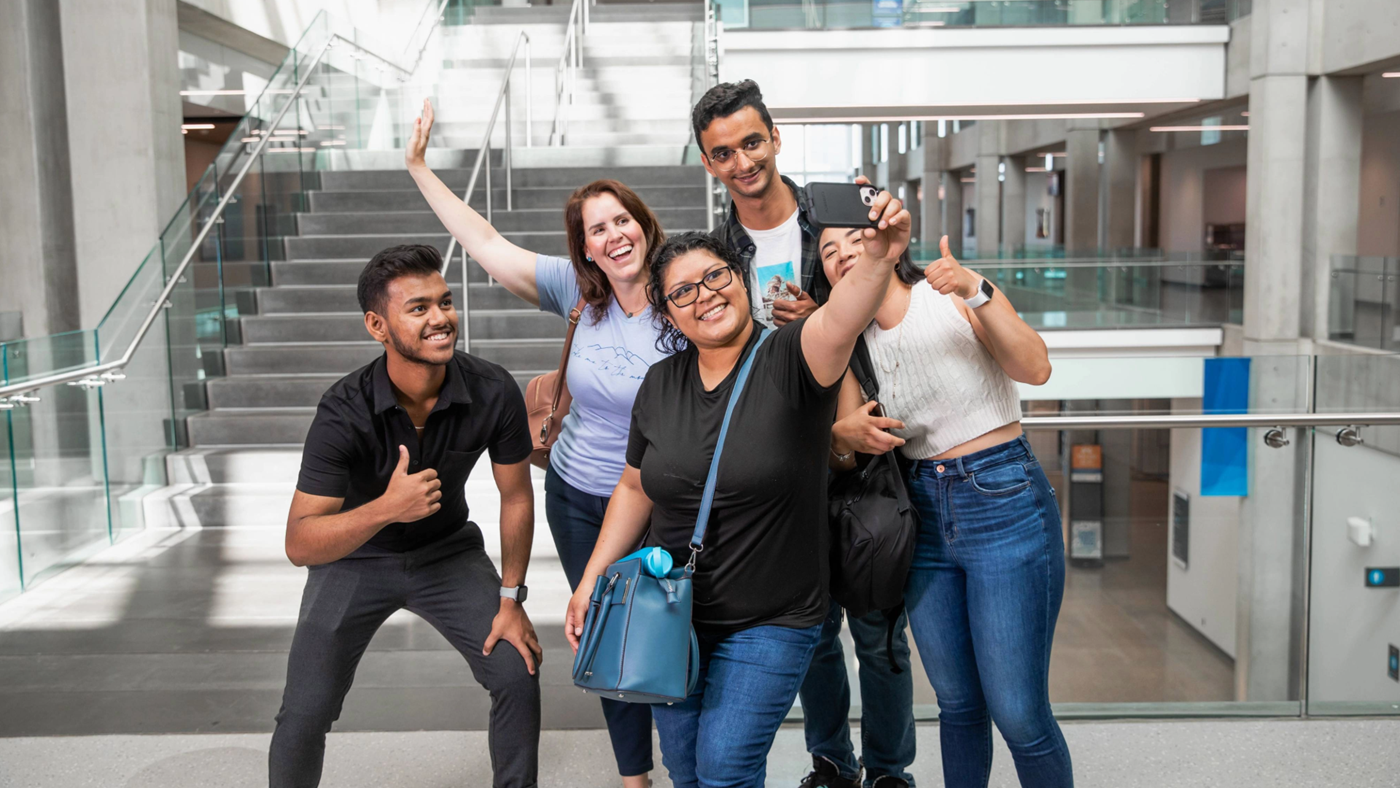 students taking a group selfie at NAIT campus