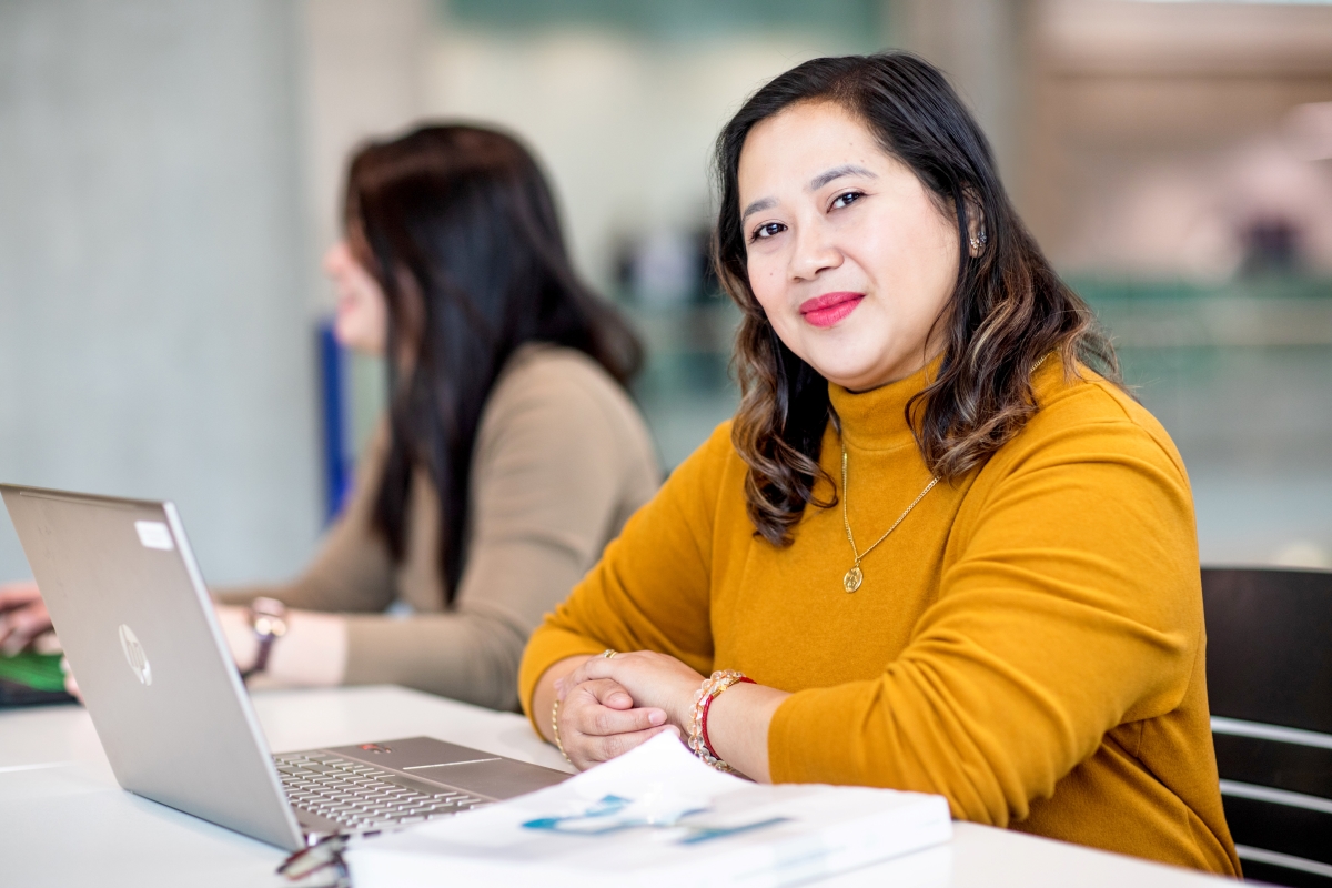Lady Lexely Bangayan finishing her homework in a student common area on NAIT's main campus