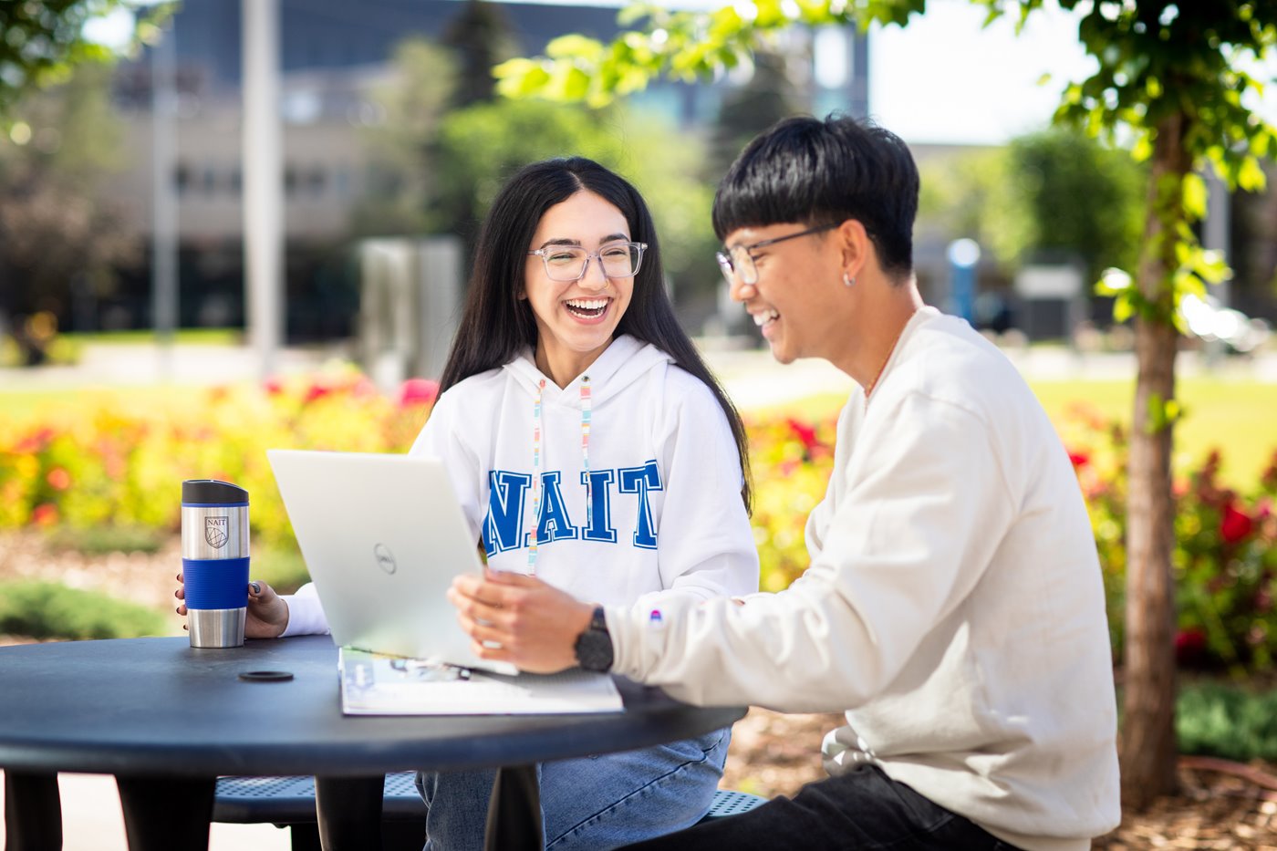 two students at picnic table