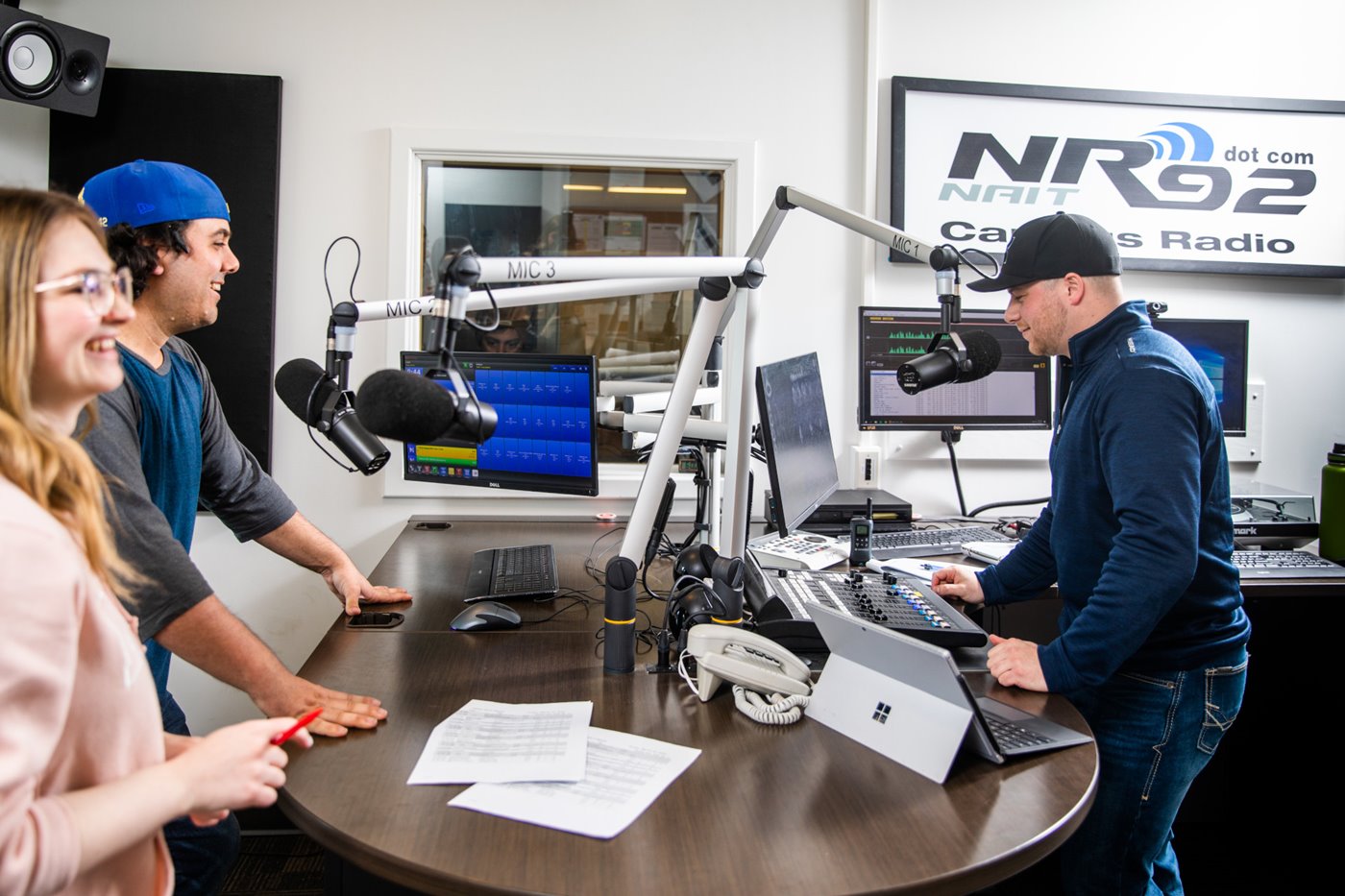 Radio and Productino Student stands in a studio