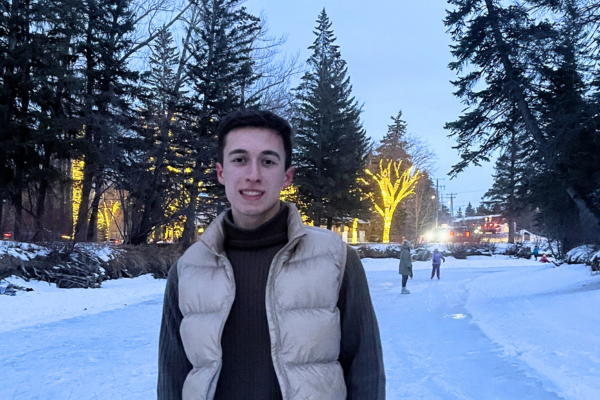 student at an outdoor skating rink in winter