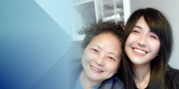 Photo of ShangYi Chan (construction engineering technology student and award recipient) and her mother