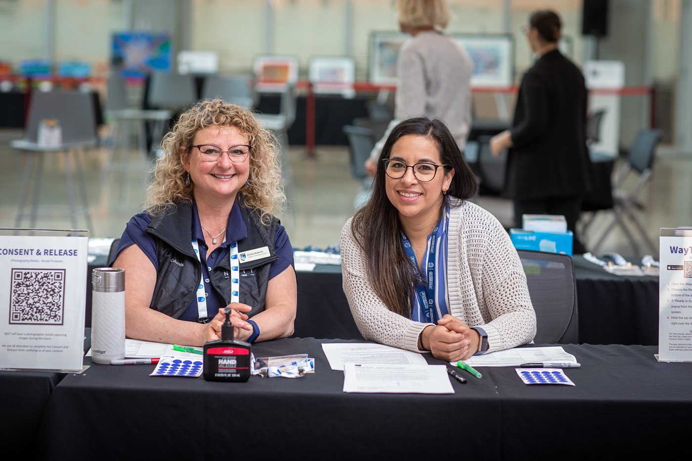 AccessAbility Symposium 2023 speaker and interpreter on stage